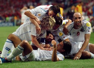 Czech Republic players celebrate with Milan Baros after his goal against Denmark at Euro 2004.