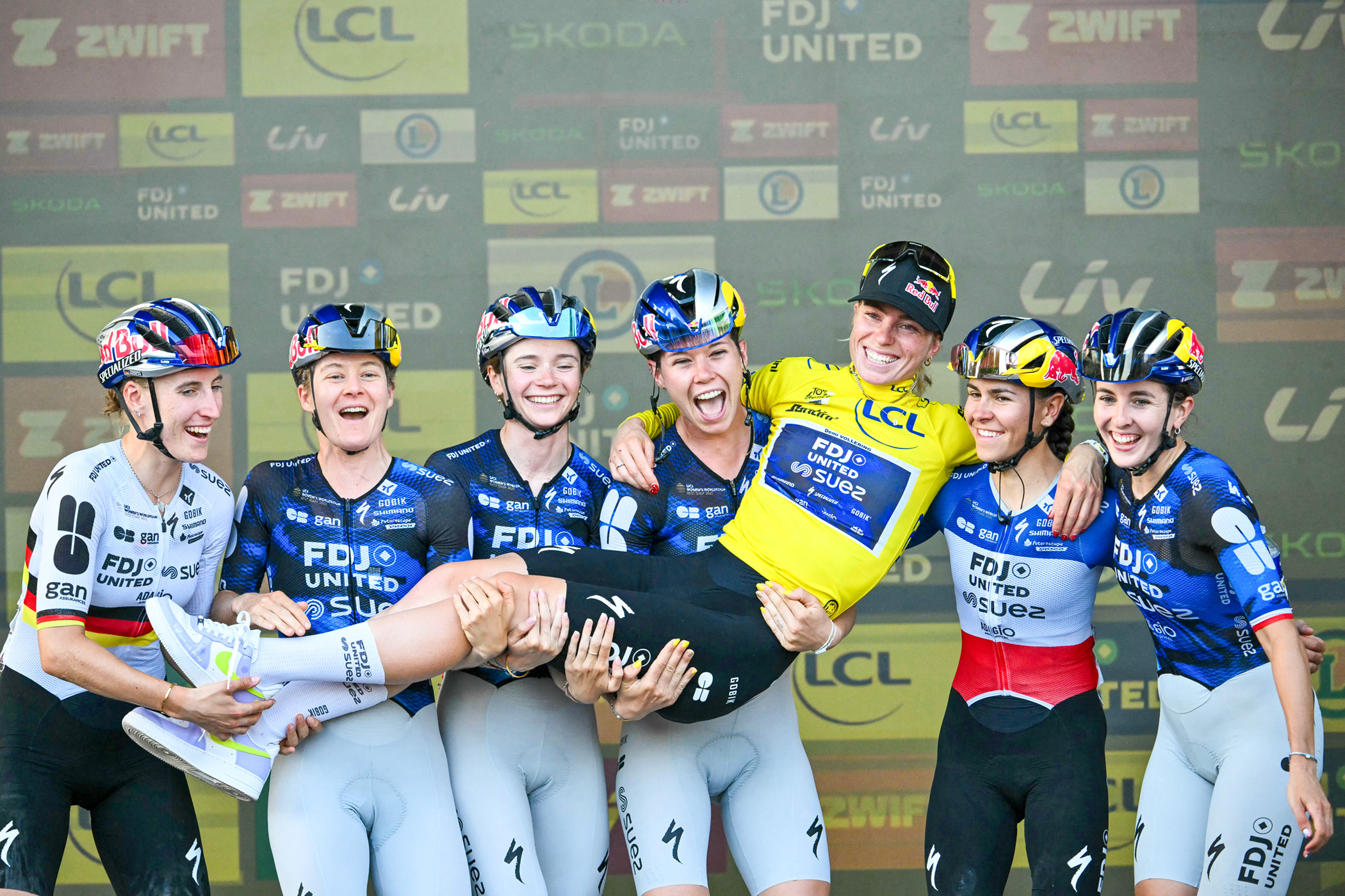 FDJ-SUEZ's Dutch rider Demi Vollering (C), wearing the overall leader's yellow jersey, celebrates with teammates after winning the 9th and final stage and the fifth edition of the Women's Tour de France cycling race, 99.2 km from Nice to Nice, southeastern France on August 9, 2026. (Photo by NICOLAS TUCAT / AFP via Getty Images)