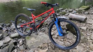 Cotic FlareMax mountain bike near a river