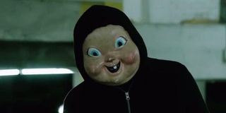 Person wearing a baby mask in Happy Death Day