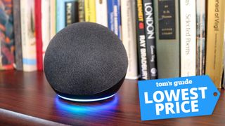 Amazon echo dot 4th gen on a bookshelf with a Tom's Guide deal tag