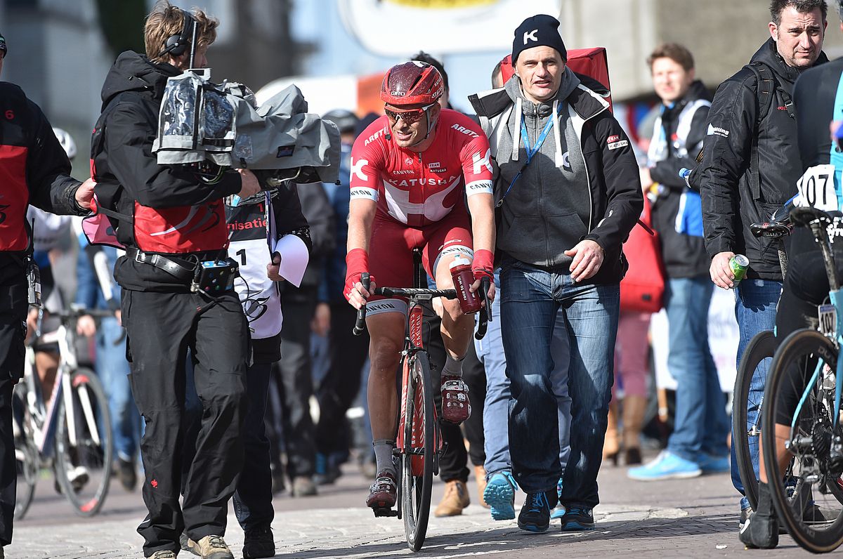 Alexander Kristoff (Katusha) is escorted to the podium after winning the stage