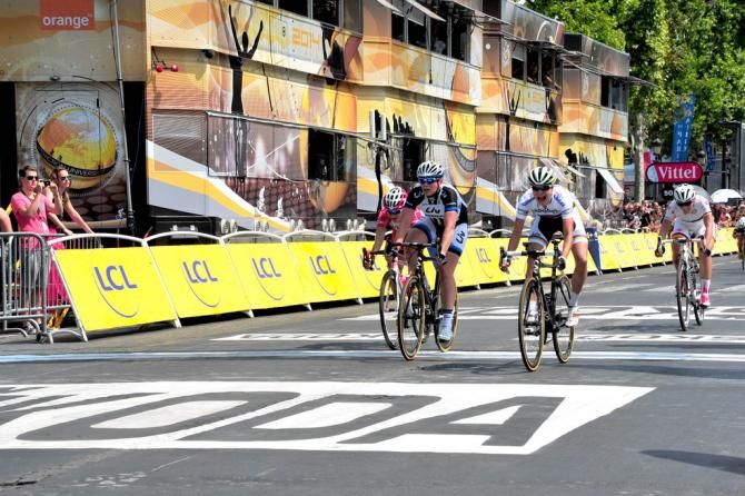 Marianne Vos (Rabo-Liv) throws her bike for the win