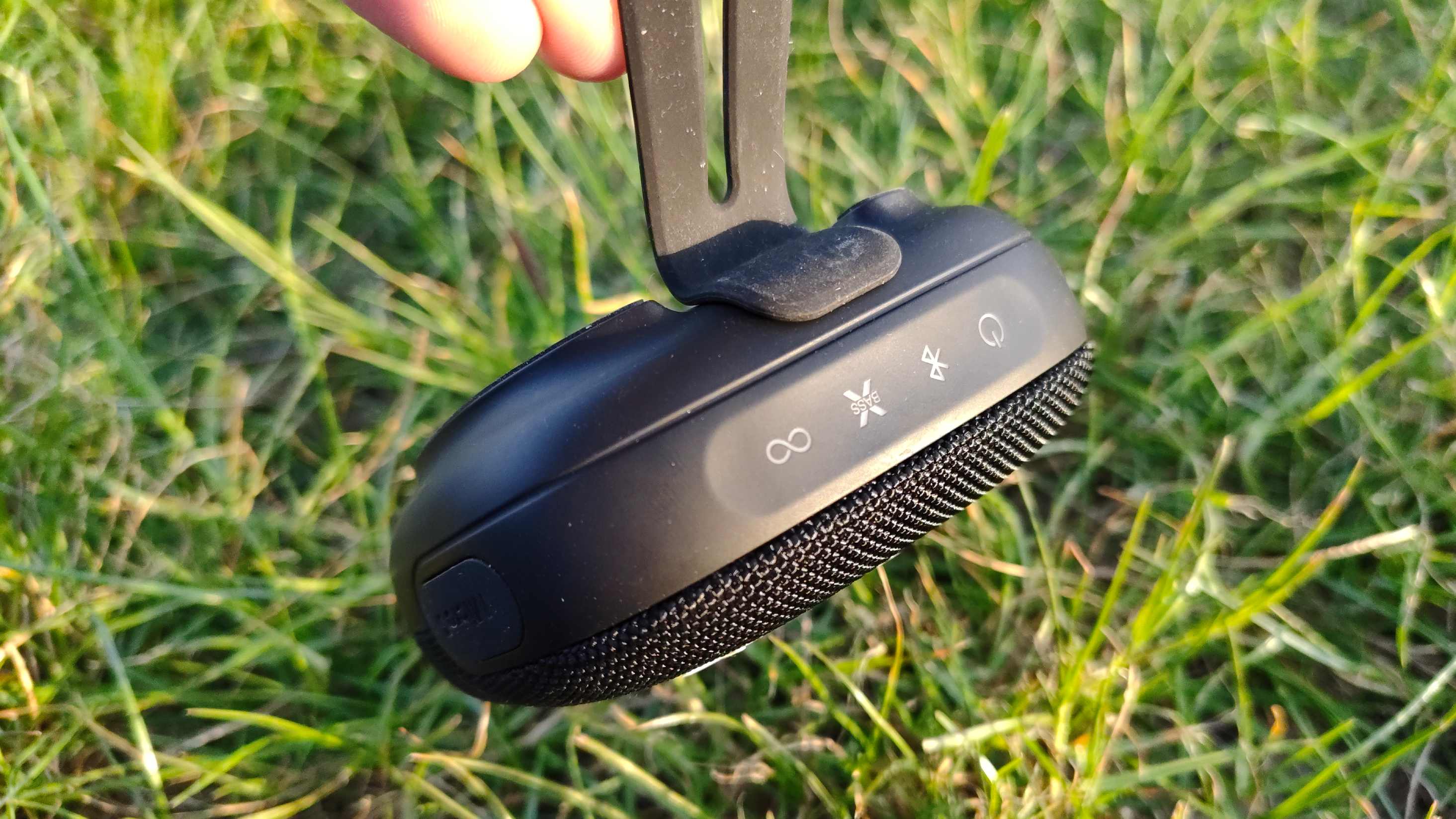 The Tribit Stormbox Micro 3 on a grassy backdrop.