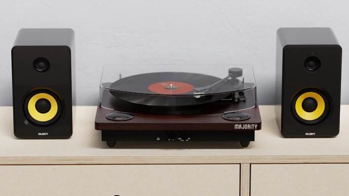 Majority Moto Bluetooth turntable flanked by black and yellow speakers 