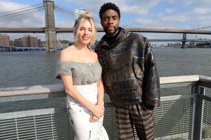 Sienna Miller(L) and Chadwick Boseman poses during a photo call for "21 Bridges" at The Fulton on November 19, 2019 in New York City.