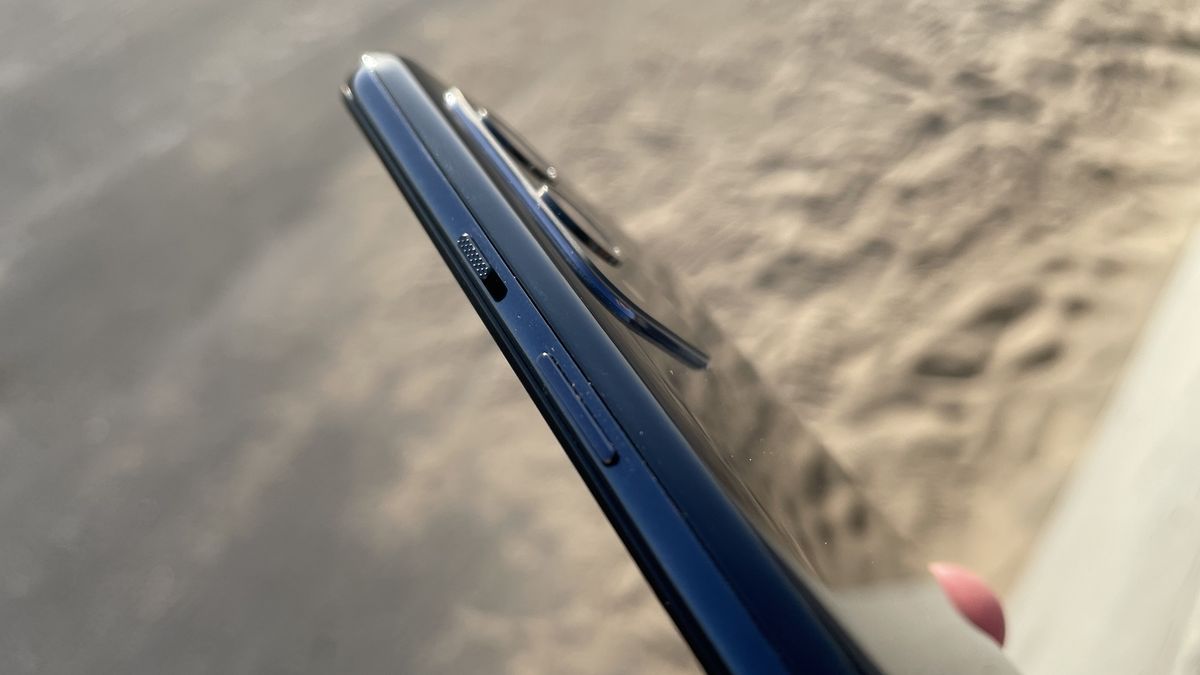 A close-up of the edge of a OnePlus 9