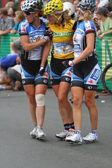 Overall leader Kristin Armstrong gets some help from her teammates after the horrific stage four crash.