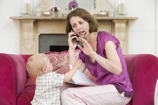 mother with baby and cell phone