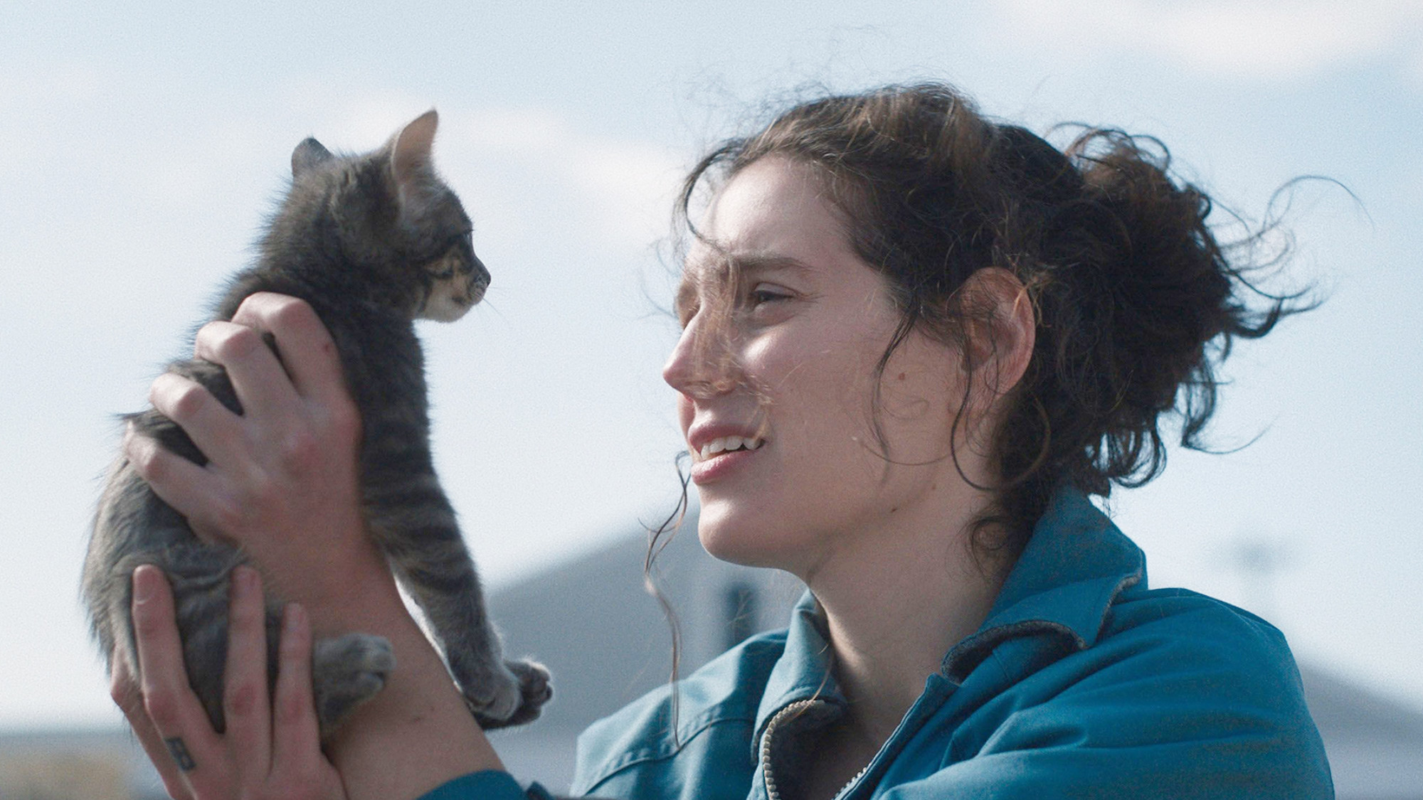 A woman holds a cat