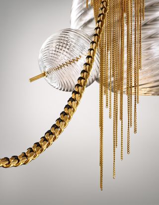 Lindsey Alderman light with glass sphere and gold chains