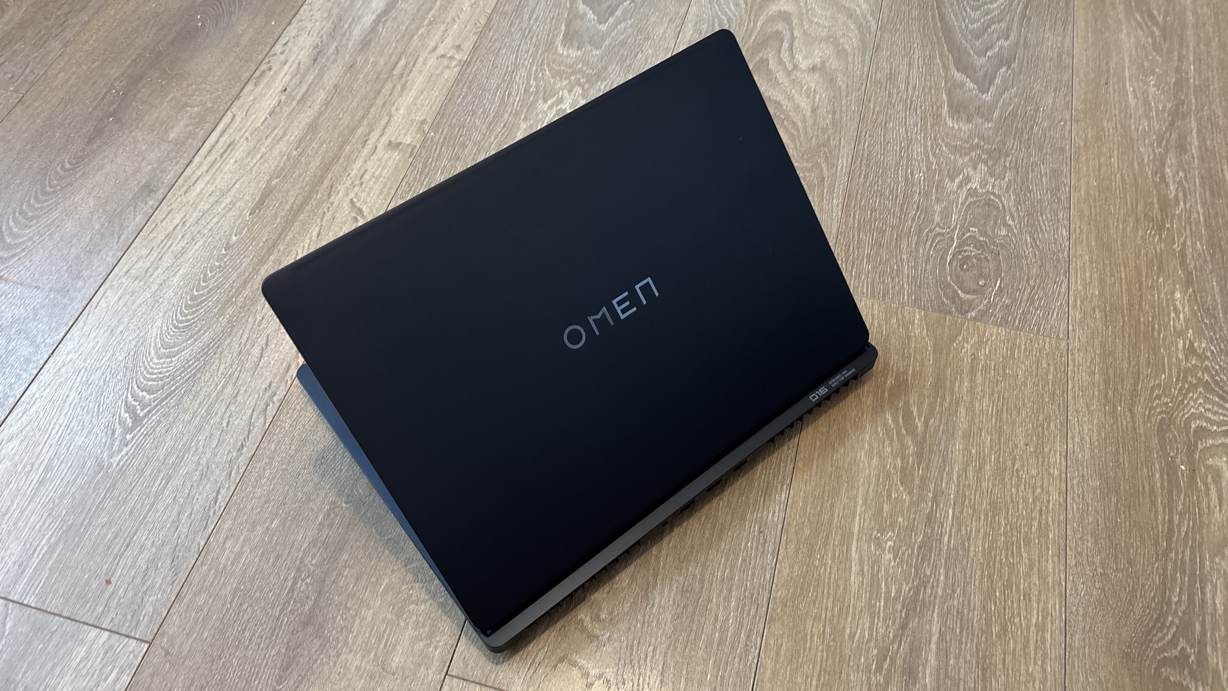HP Omen Max 16 gaming laptop on wooden surface