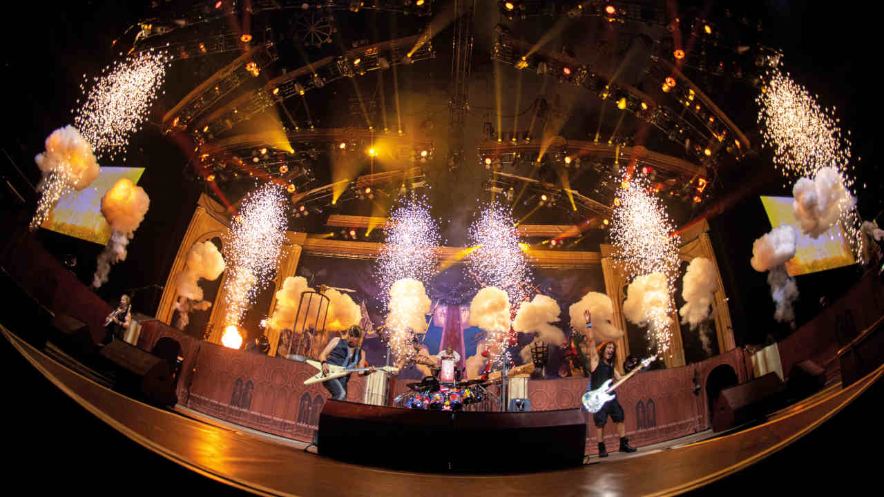 Iron Maiden performing onstage in 2021