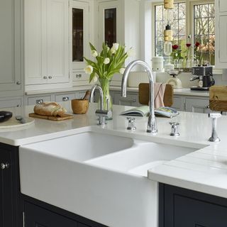 kitchen with white cabinet and white sink