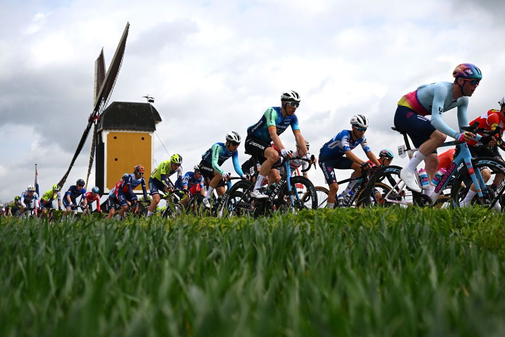 Field races past a windmill
