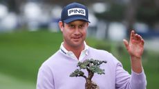 Harris English with the Farmers Insurance Open trophy