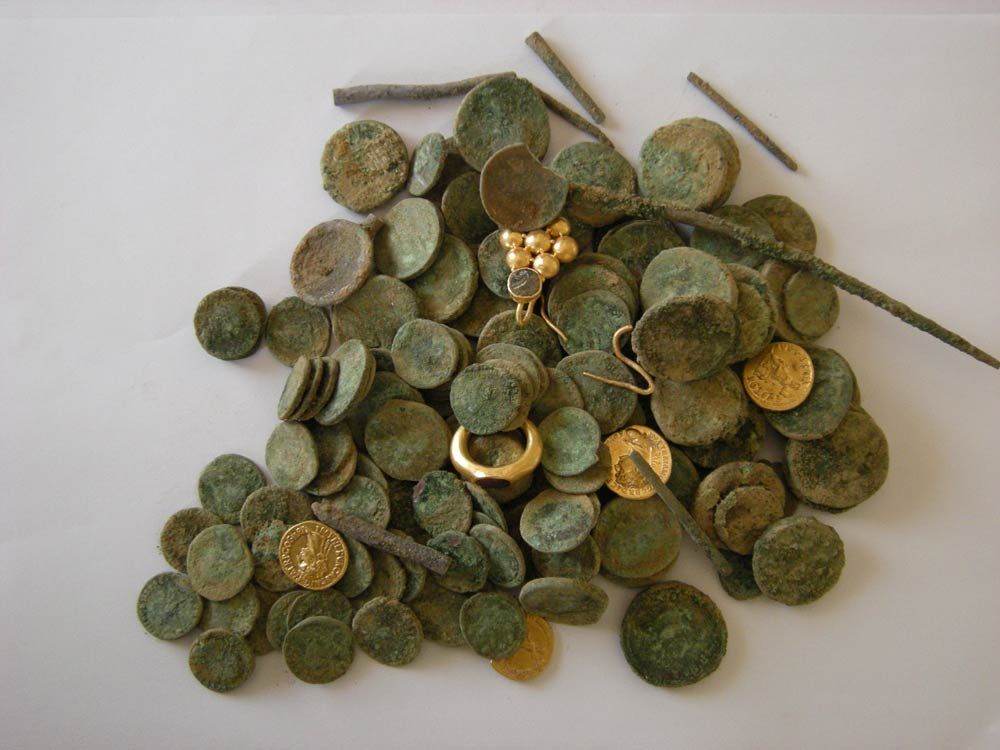 A treasure trove of gold and silver coins along with gold jewelry was uncovered in Israel and dates back to the Roman Empire.