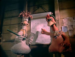 (L, R) Mac (Lynn Ferguson) and Ginger (Julia Sawalha) pointing to plans in Chicken Run