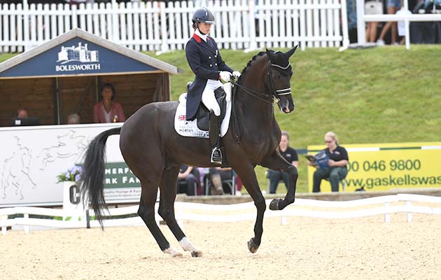 Charlotte Fry riding Dark Legend in the CDI3* Grand Prix during the Equerry Bolesworth International Horse Show at Bolesworth Castle near Chester in Cheshire in the UK on 13th June 2018