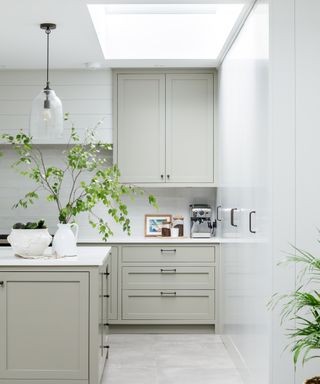 gray kitchen with white worktops