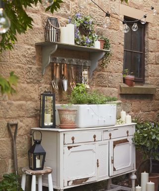 outdoor potting bench and tool storage with decorations from Lights4fun