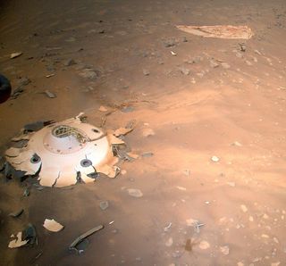 Some of the landing gear of NASA's Perseverance Mars rover, as imaged by the space agency's Ingenuity helicopter. Could Earth microbes have been transported to Mars in the wreckage?