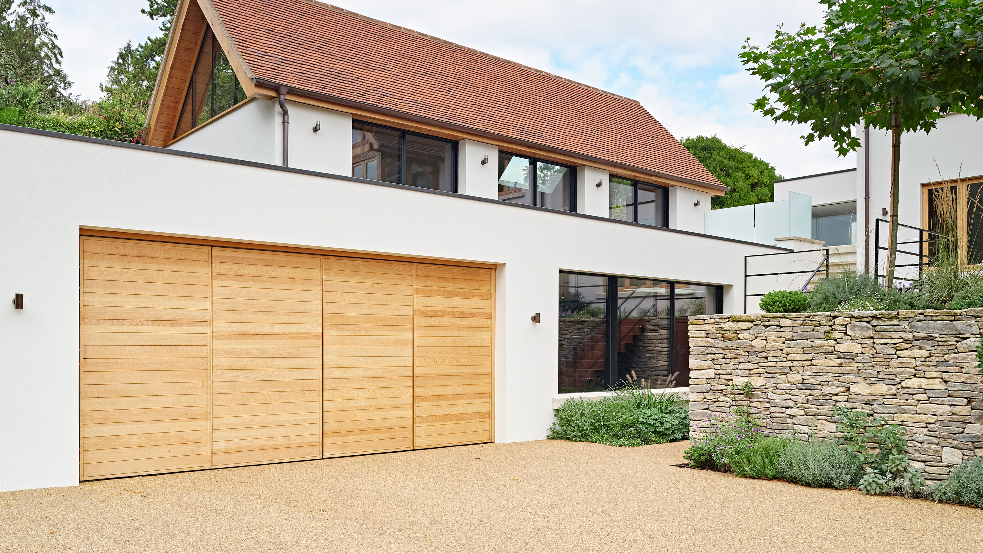 contemporary house with resin bound gravel driveway