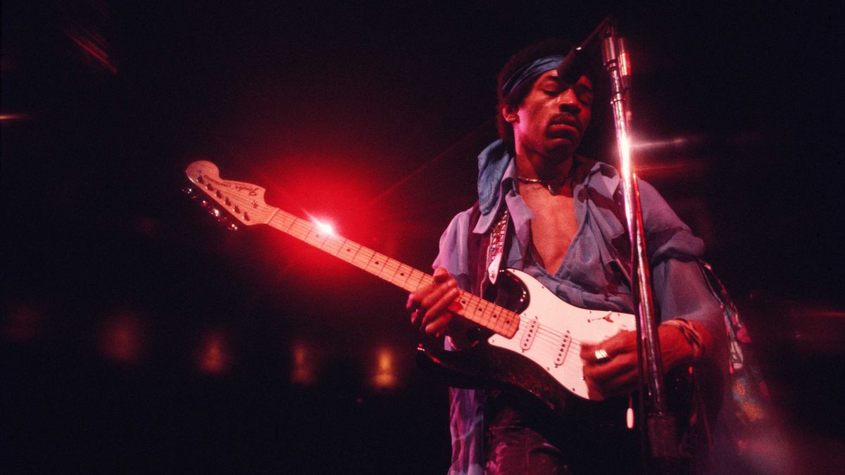 Jimi Hendrix plays a black Stratocaster with a maple fingerboard