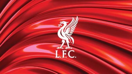 Liverpool FC logo on a textured red shiny background 