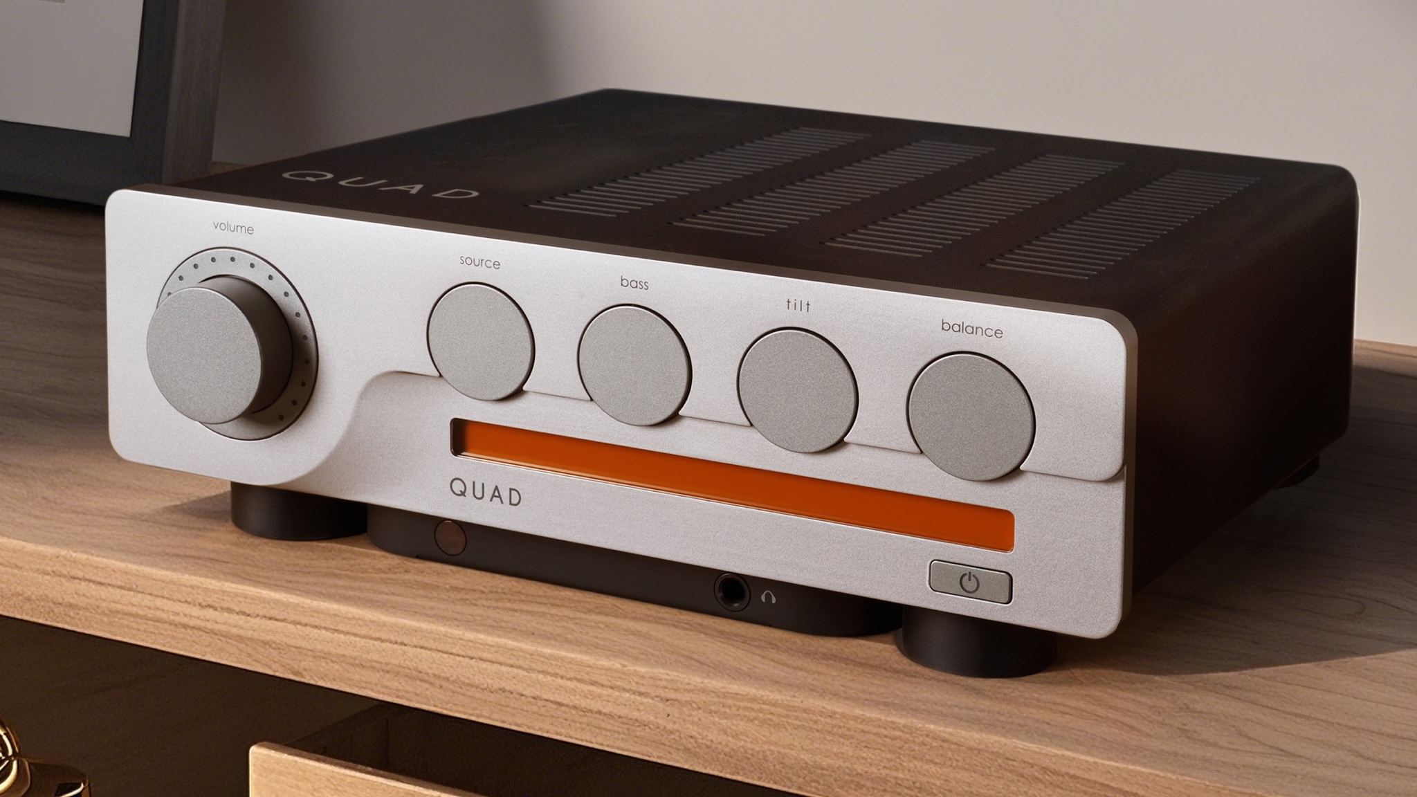A photo of the Quad 3 amplifier on top of a wooden sideboard