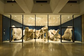 Installation at the Rice Gallery. There is a wooden construction that represents a canyon.
