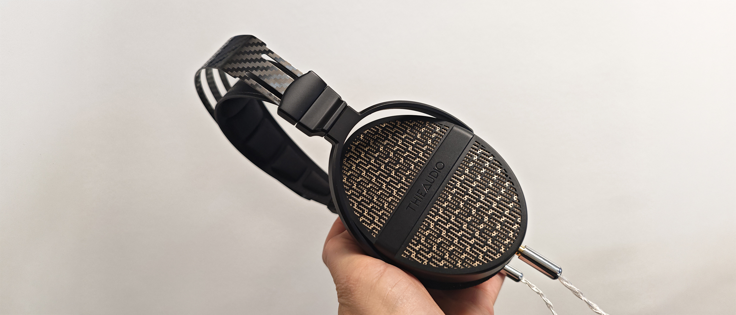The Theiaudio Cypher headphone in a work office setting. 