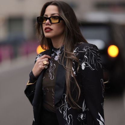 Lenia Perez wearing black / white patterned Vipop Blazer and top with the ghost haircut