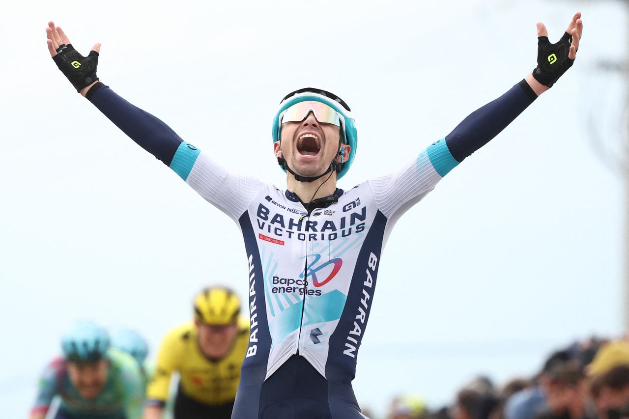 Bahrain Victorious' French rider Lenny Martinez celebrates as he crosses the finish line to win during the 5th stage of the Paris-Nice cycling race, 203,3 km between Saint-Just-en-Chevalet and La C&ocirc;te-Saint-Andr&eacute;, on March 13, 2025. (Photo by Anne-Christine POUJOULAT / AFP) (Photo by ANNE-CHRISTINE POUJOULAT/AFP via Getty Images)