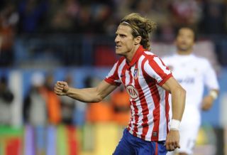Diego Forlan scores for Atletico Madrid against Real Madrid in November 2009.