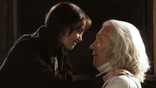 Elizabeth and her father looking at each other and smiling at the end of Pride & Prejudice (2005)