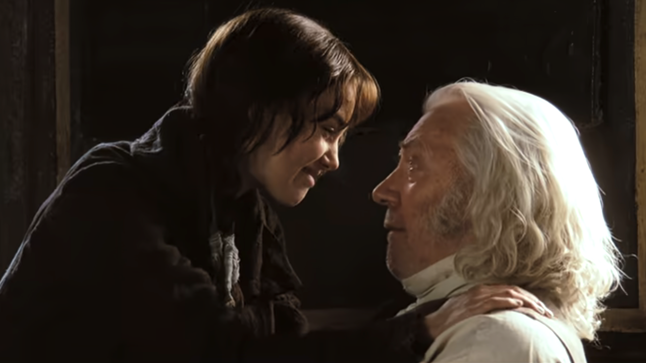 Elizabeth and her father looking at each other and smiling at the end of Pride & Prejudice (2005) 