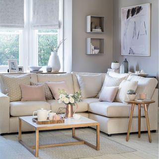 neutral living room with cream corner sofa and wooden coffee table