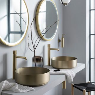 bathroom trends, grey and brushed brass bathroom with brass fixtures, fittings and sinks