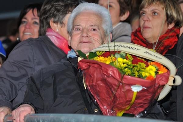 Kevin Pauwels' grandmother holds onto his bouquet.