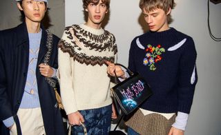 3 male models posing in knitwear