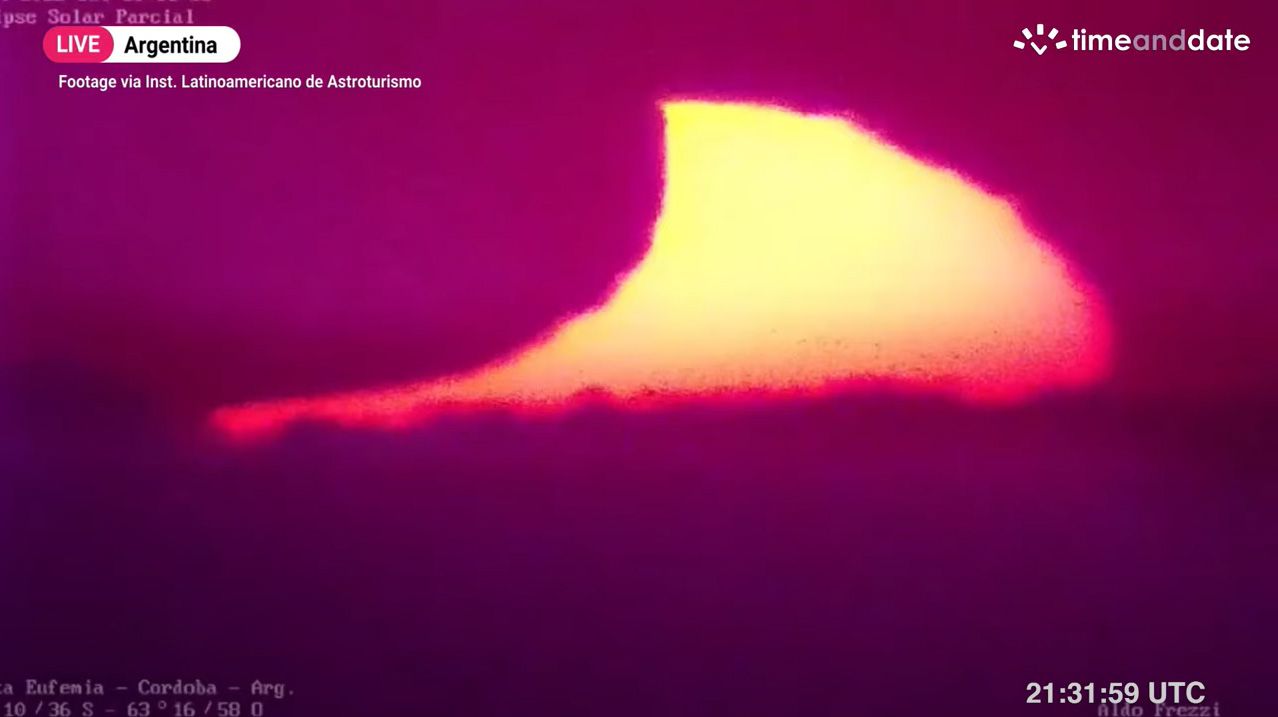 The partial solar eclipse of April 30, 2022 is seen at sunset in this zoomed in view from Argentina by Timeanddate.com and partner Latinoamericano de Astroturismo.