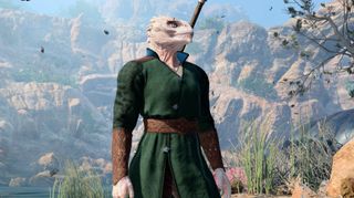 Baldur's Gate 3 - A white dragonborn character in robes