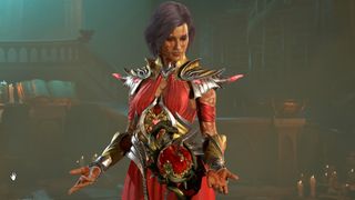 Diablo 4 Sorceress wearing red metallic armor looking down at her hands
