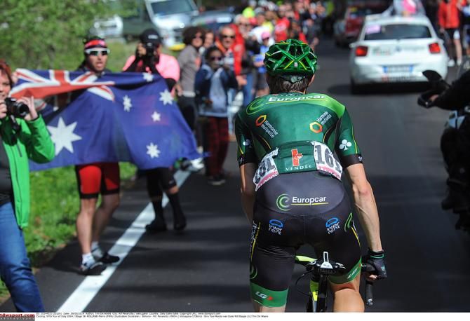 Team Europcar's Pierre Rolland rides through the race fans on the way in Stage 18