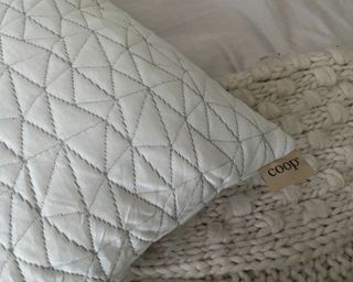Coop Home Goods Adjustable pillow corner with tag