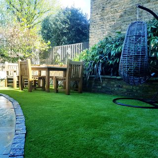 garden with dining table and swing