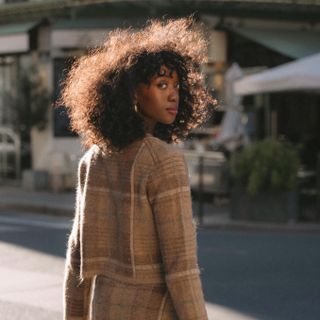 Woman with curly hair.