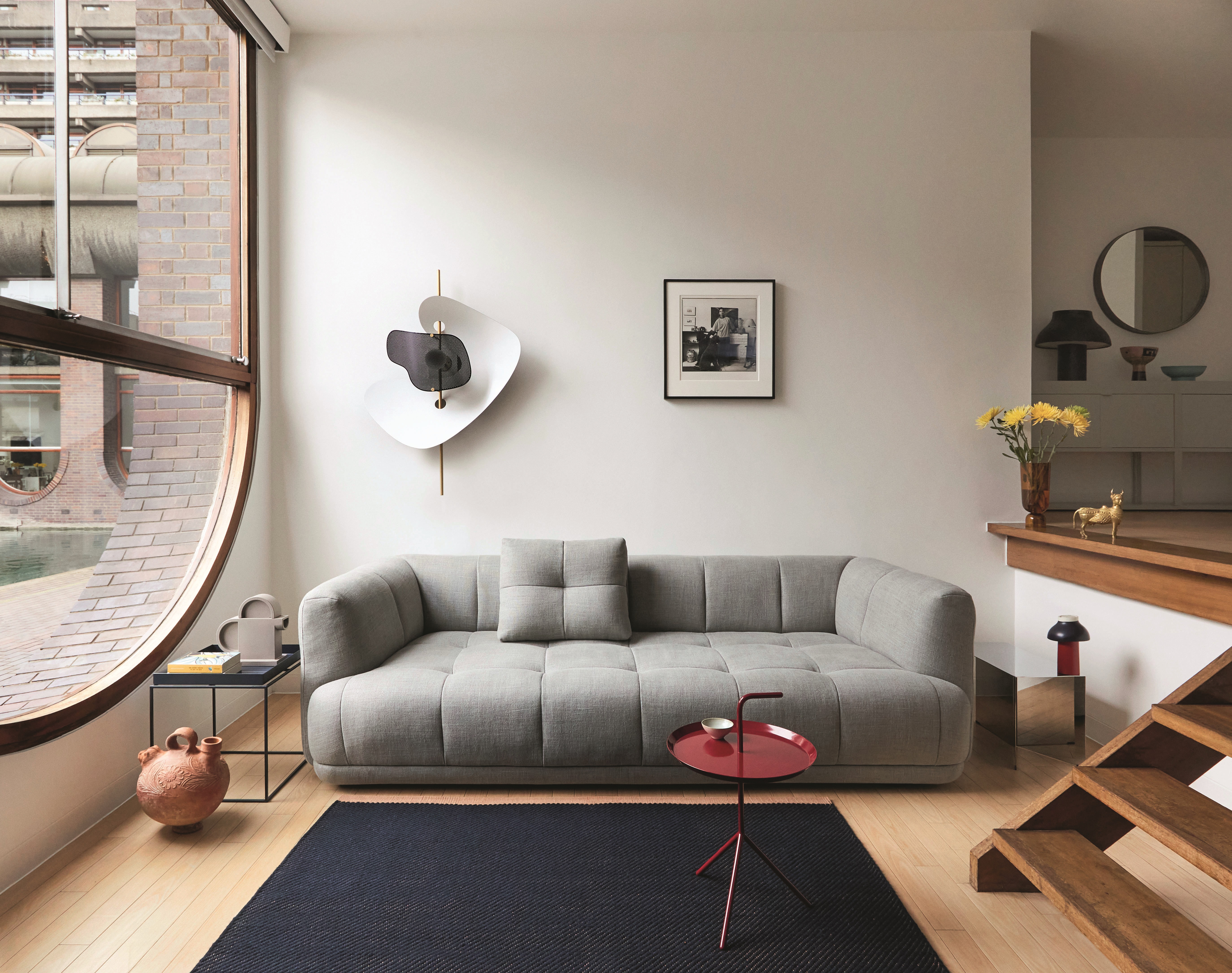 A living room with a wall sconce designed as roses