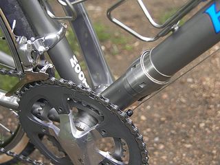 A close up of a coupler on a Moots downtube